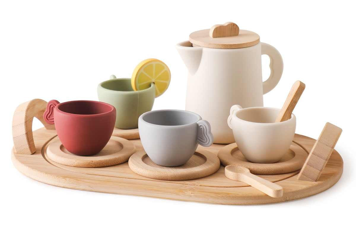 Silicone and wooden Montessori tea set on neutral background for pretend play