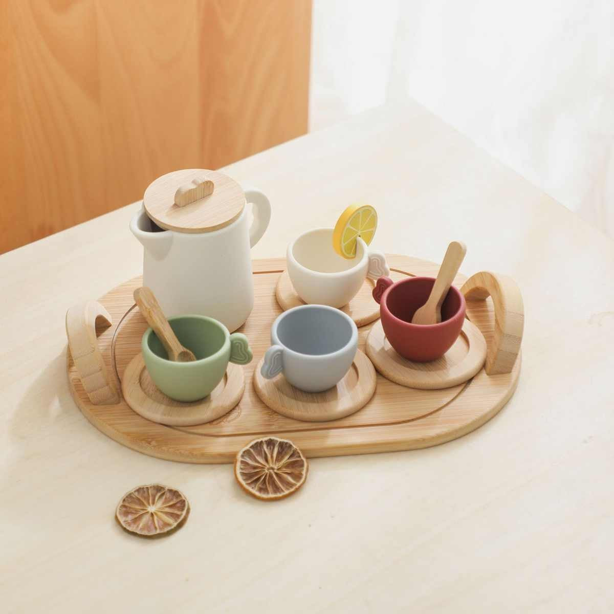 Montessori wooden tea set arranged on neutral table for pretend play tea party