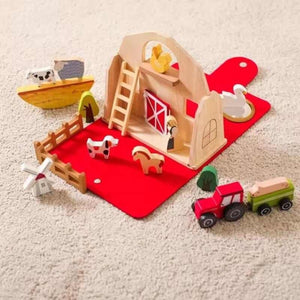 Montessori farm set laid out on carpet in home environment for imaginative play
