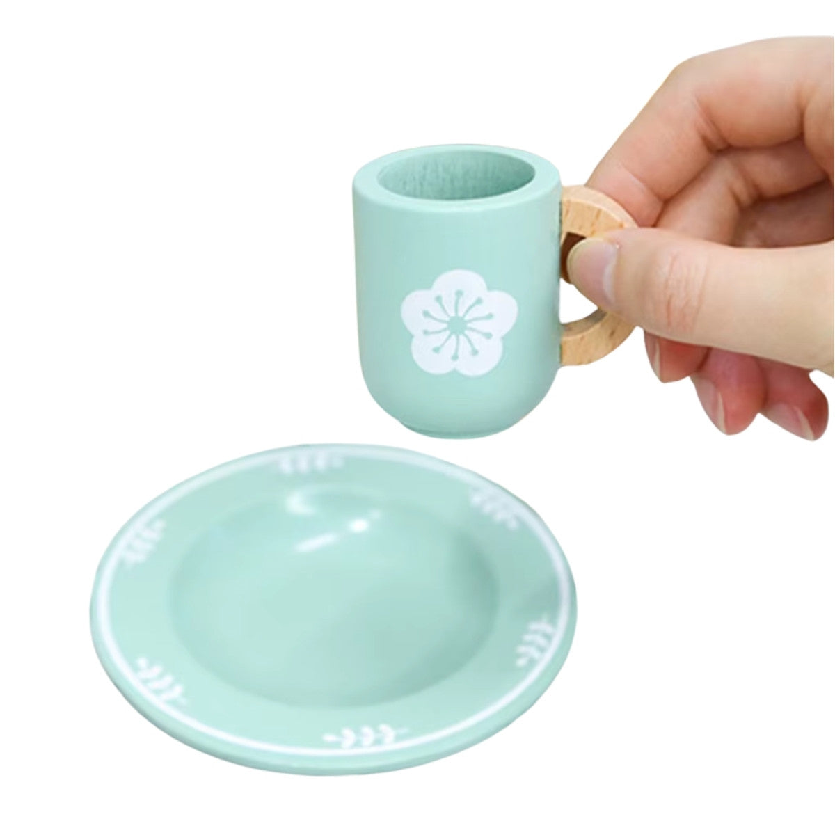 Close-up of wooden cup and dessert plate from Montessori kitchen set for imaginative kitchen play