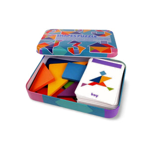 Open box displaying wooden tangram puzzle pieces and colorful task cards for preschool educational activities