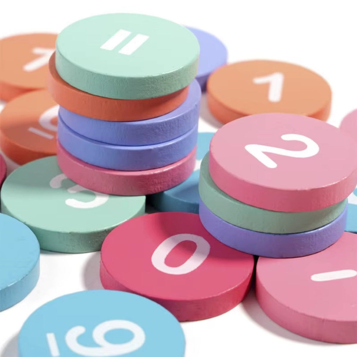 Close-up of colorful wooden number chips and math symbols for hands-on counting