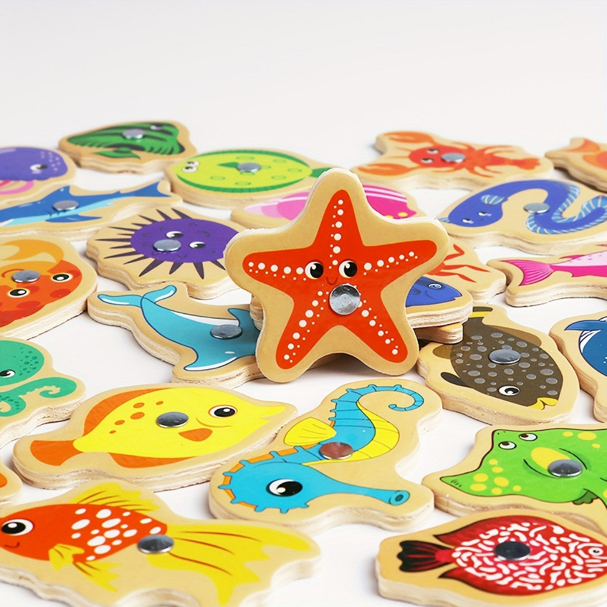 Colorful wooden fish pieces with magnets for Montessori fishing game
