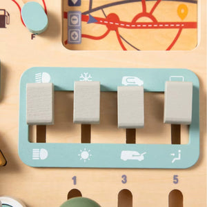 Close-up of interactive wooden sliders for lights and air controls on Montessori busy car board