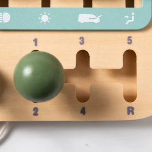 Close-up of wooden gear shifter on Montessori busy car board for fine motor skill development
