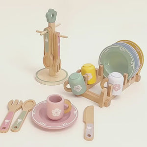 Montessori wooden kitchen accessories being assembled for role-play activities
